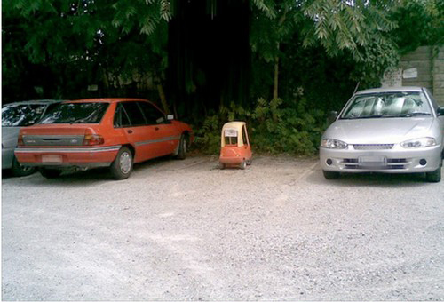 Toy car in a real parking spot