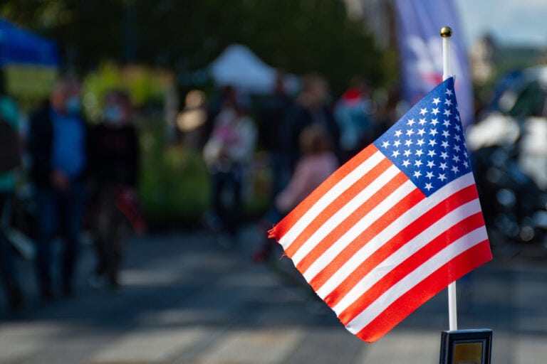 In part of the song, he sings: “Cuss out a cop, spit in his face / Stomp on the flag and light it up.”