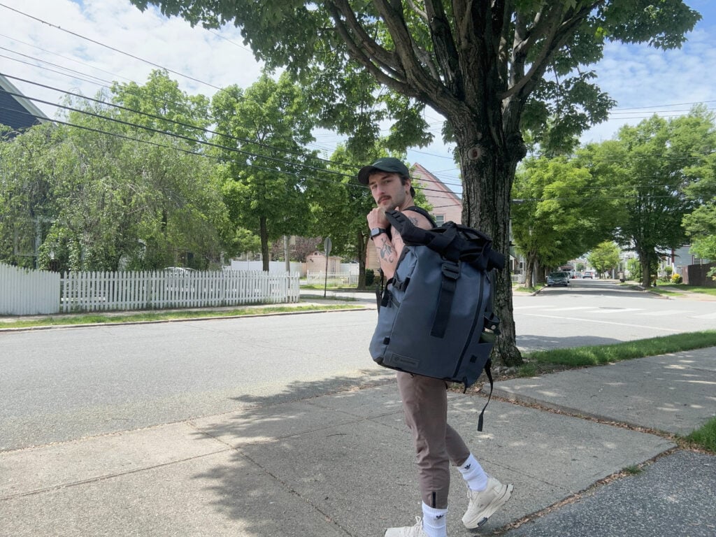 Here I am lugging the PRVKE Travel Backpack on the way to a coffee shop.
