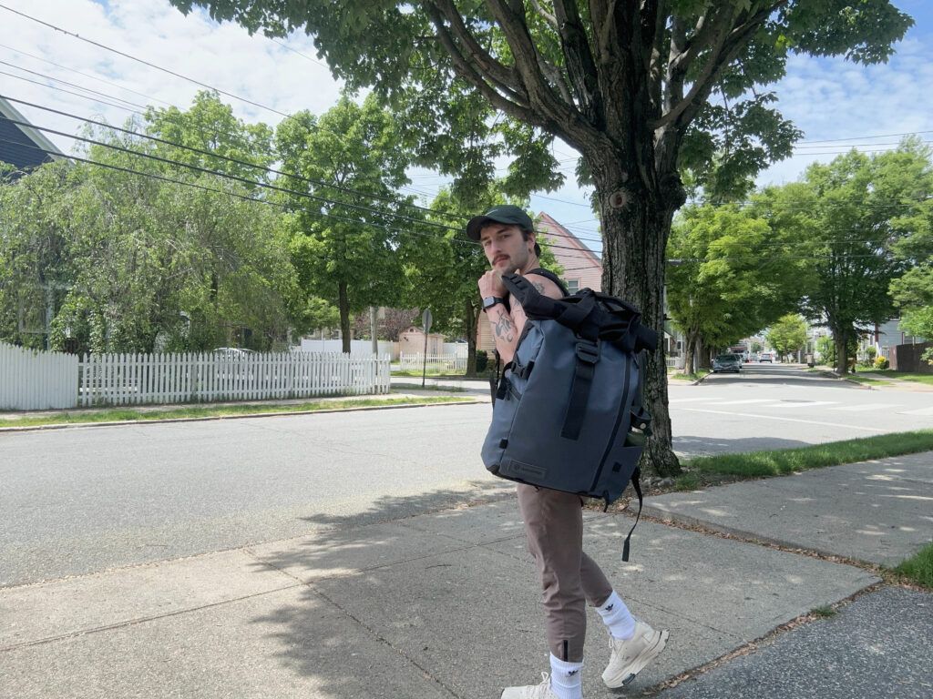 Here I am lugging the PRVKE Travel Backpack on the way to a coffee shop.